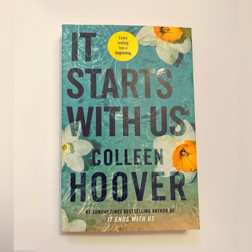 It Starts With Us by Colleen Hoover. Paperback book